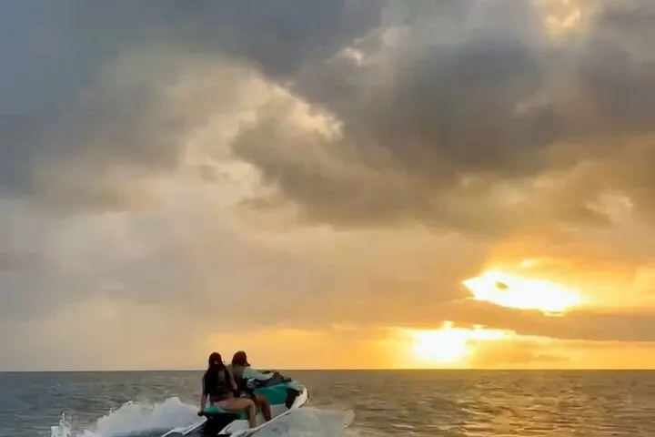Jet ski silhouetted against the sunset off Cabo Rojo on a jet ski rental in Puerto Rico